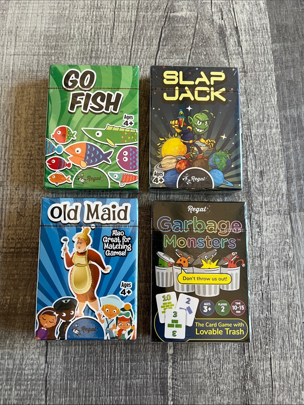 NIB Regal Games Kids Classic Card Game Bundle 4 Pack Go Fish Garbage Monsters